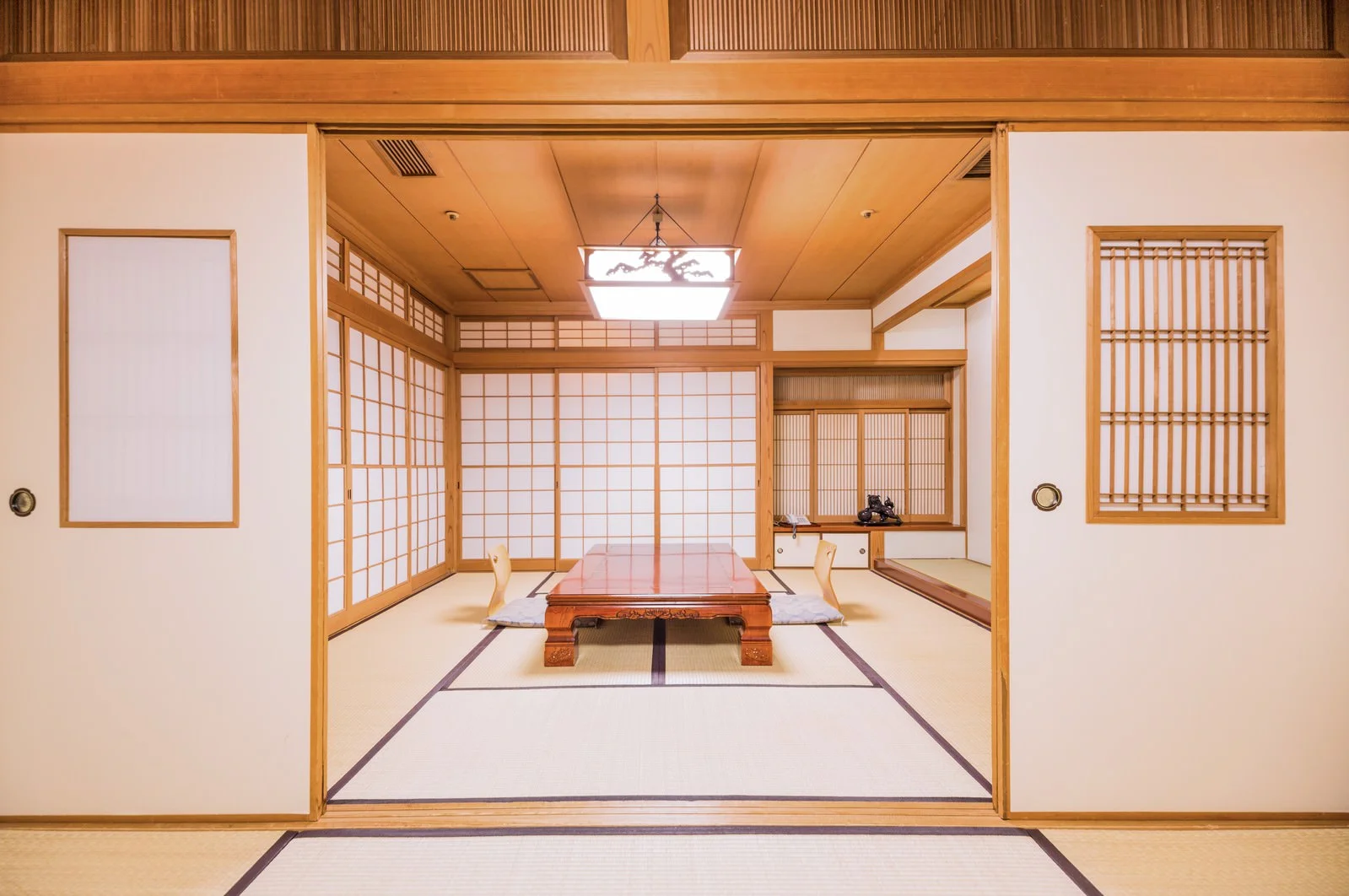 Japanese-style tatami room with wooden table and sliding doors