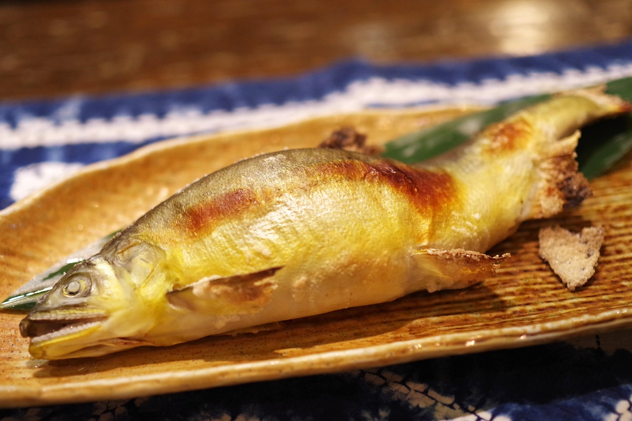 Grilled ayu sweetfish served on a traditional Japanese plate