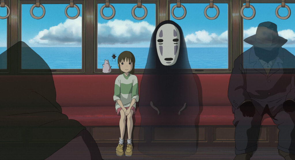alt="No-Face and Chihiro riding the train in Spirited Away(千と千尋の神隠しで電車に乗るカオナシと千尋)"