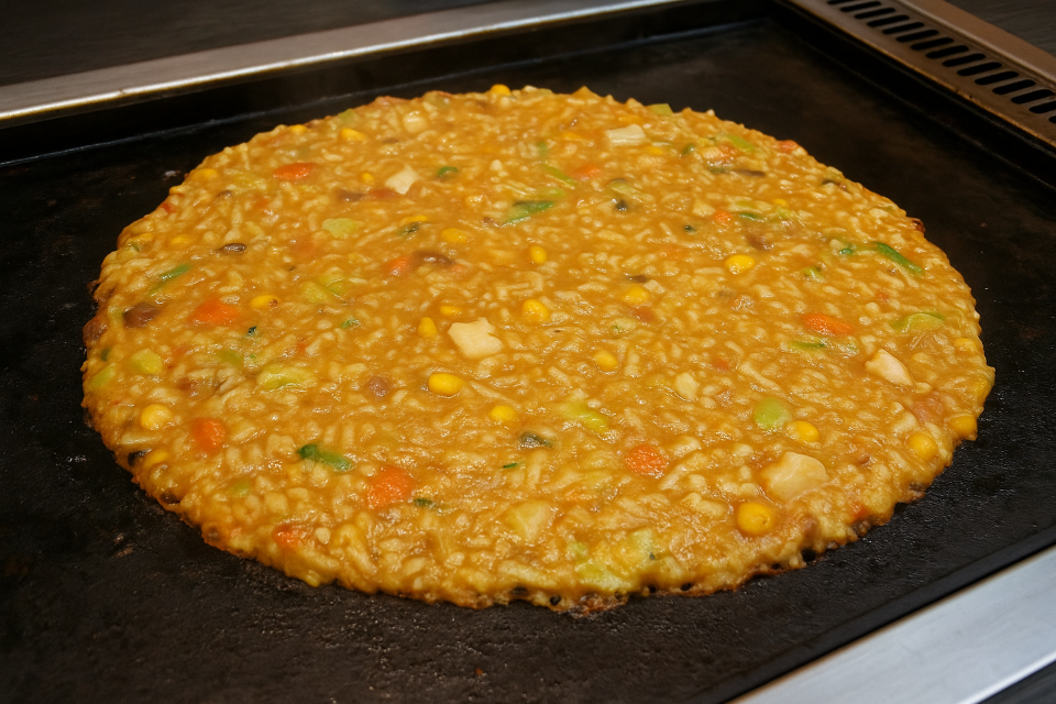 Pan-fried batter dish with various toppings (Monjayaki from Tokyo)