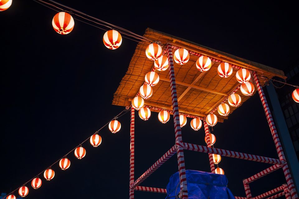 Lanterns illuminating a Japanese summer festival street