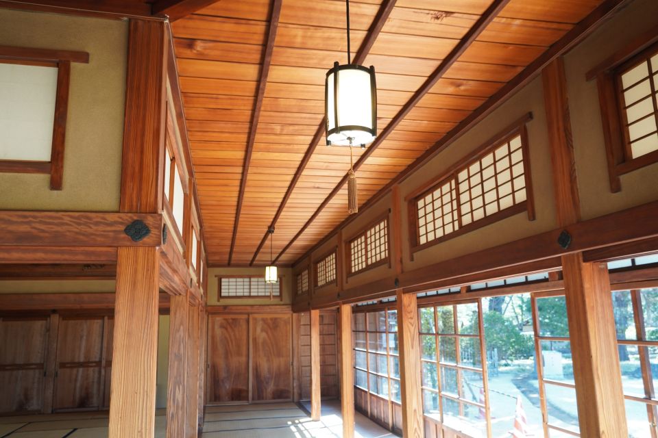 Interior of a traditional Japanese house with wooden beams and earthen walls