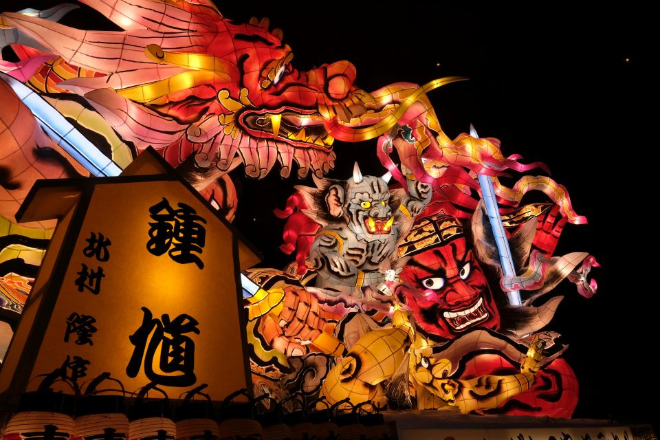 Large illuminated float of Nebuta Matsuri parading through Aomori at night